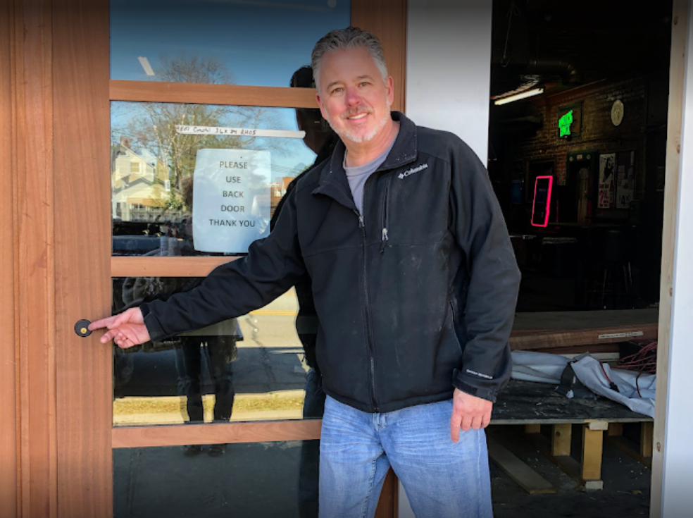 Professional locksmith installing high-security commercial door hardware for a Columbia SC business.